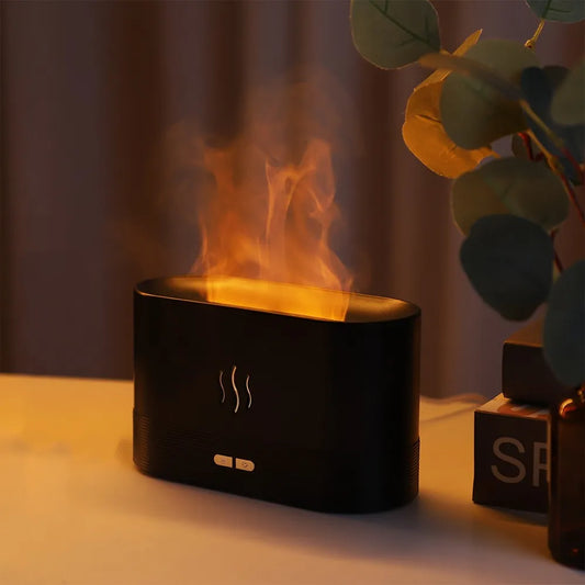 Black diffuser with flames on a warm-toned background